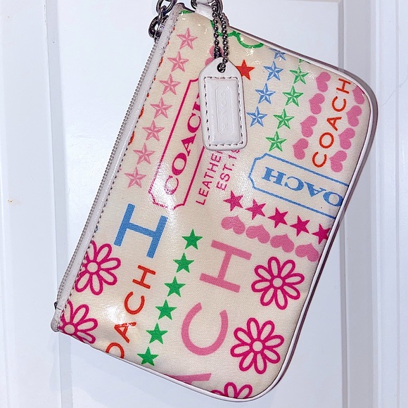 Coach Handbags - Coach wristlet multi colored pattern.
